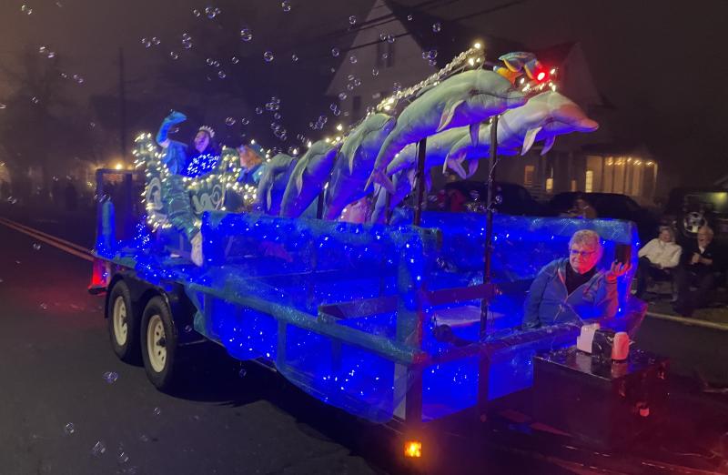 With dolphins leading the way, the Marine Education, Research and Rehabilitation Institute rolls down the parade route. The float took top honors in the community float division and first place in the clowns division.